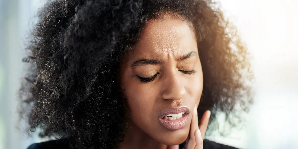 Dente Dolorido ao Toque Após Canal: Causas e Soluções